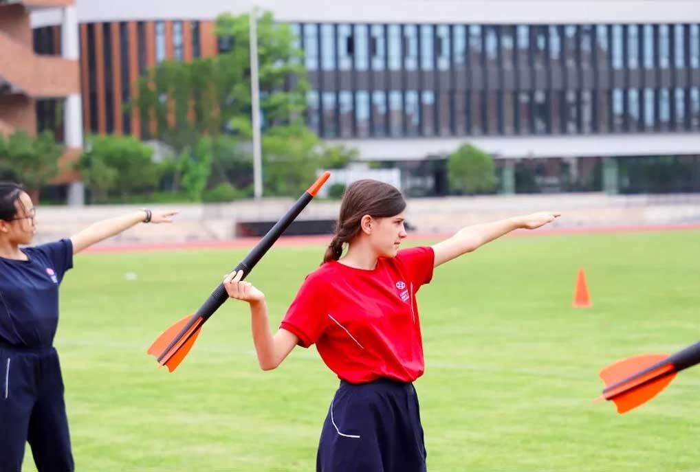 A pupil does sport at King's College School Hangzhou